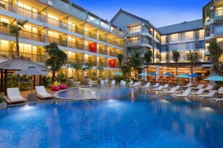 Poolside exterior shot of Ramada Encore in Seminyak, Bali